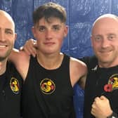 Boston ABC coaches Dennis Watson and Matthew Mooney pictured with Jamie Burgin after his victory on Saturday night.