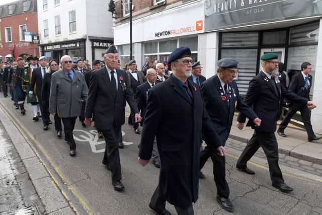 Veterans and British Legion members take pride of place in the parade. EMN-211115-103756001