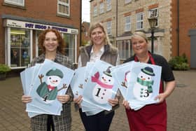From left - Harriet Baker of Millstream Square, Lucy Newton and Sarah Graves of Bristol Arcade with their snowmen trail