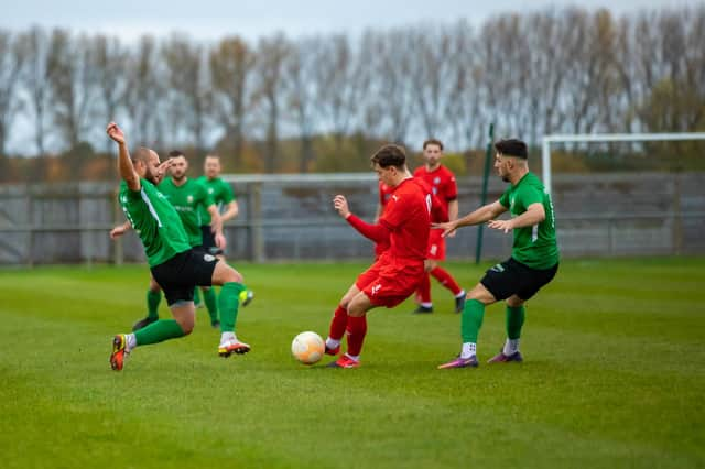 Mitch Griffiths slides in against Heanor. Photo: Craig Harrison