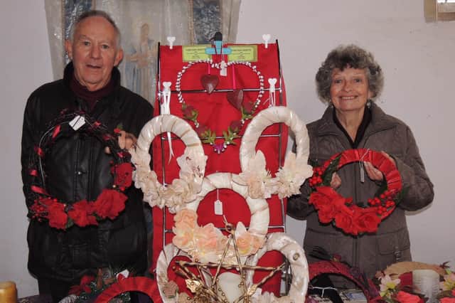 Ken and Ann Garrill of Sleaford with their Coritani Crafts stall at Silk Willoughby Church's Crafts By Candlelight. EMN-210611-182213001