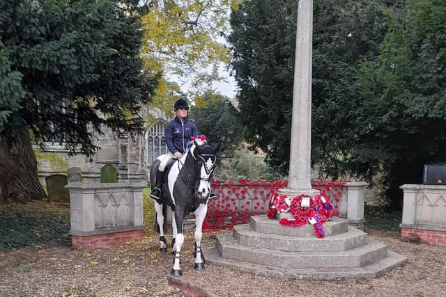 A horse rider takes part in a special service at Friskney to remember the millions of horses that died during the First World War. Photo by Mavis Elwick.