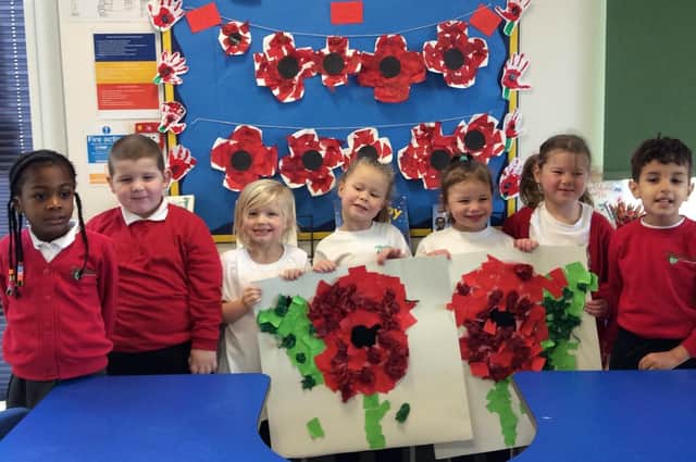 Children with crafted poppies.