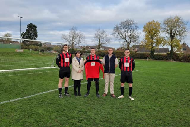 Rob Hodgekins, Azza Burton and Lee Twigg receiving the kit.