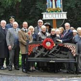 The Mayor of Louth, Councillor Darren Hobson; Rotary Club president, Rob Hall; Air Vice Marshall (Retired) Martyn Gardiner, and ex-Red Arrow Alan Chandler alongside the new bench and the members of the public who attended