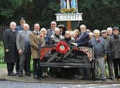 The Mayor of Louth, Councillor Darren Hobson; Rotary Club president, Rob Hall; Air Vice Marshall (Retired) Martyn Gardiner, and ex-Red Arrow Alan Chandler alongside the new bench and the members of the public who attended