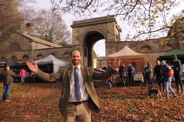 William Reeve welcomes people to the Christmas market on Leadenham Estate. EMN-211129-102101001