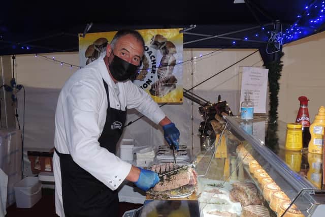 Woodhall Spa butcher Graham Fidling carving up stuffed chine baps at the Lincolnshire Food and Gift Fair. EMN-211127-170617001