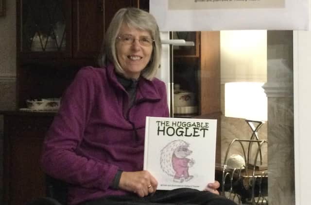 Thelma Smith, of Leasingham, with her first children's book, The Huggable Hoglet. EMN-211125-171022001