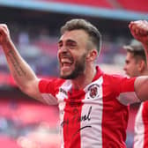 Boston United's Shane Byrne celebrates winning FA Trophy with Brackley - who he faces in the competition on Saturday. Photo: Getty Images