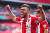 Boston United's Shane Byrne celebrates winning FA Trophy with Brackley - who he faces in the competition on Saturday. Photo: Getty Images