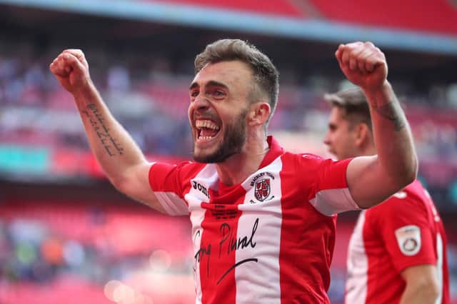 Boston United's Shane Byrne celebrates winning FA Trophy with Brackley - who he faces in the competition on Saturday. Photo: Getty Images