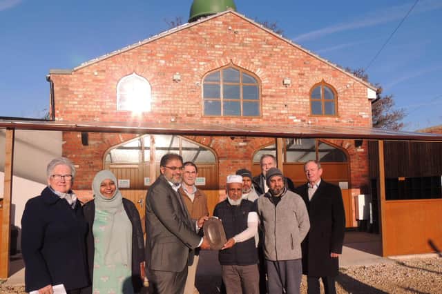 David Marriage with fellow Civic Trust members present this year’s award to Dr Saleem Ajumal, chairman of Sleaford Islamic Centre and Nadim Aziz with members. EMN-211125-121420001