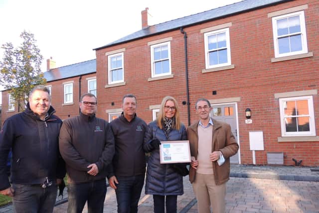 Receiving their Civic Trust award, from left - Malcolm Curt - architect, Robert Wilcox - Managing director, Will Elkington - sales director, Stephanie Wilcox and David Marriage of the Civic Trust. EMN-211125-121430001