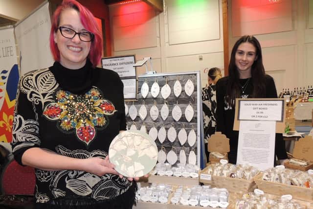 From left - Clare and Imogen Towers, trading as The Foxglove Tree, from Tetford were selling their botanical castings as gifts. EMN-211127-170606001