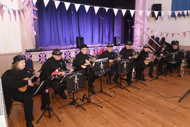 Creaking Bones ukulele group entertaining at the tea party.