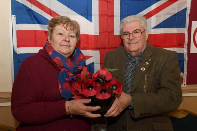 Trina Harris, treasurer, with Peter Nicholas, branch member.