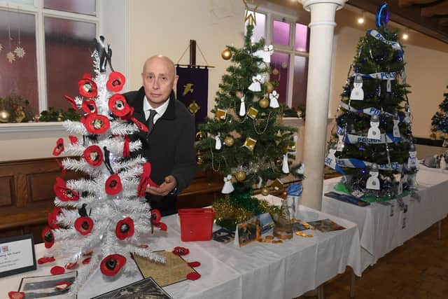 Brian Harbon decorating the Royal British Legion tree.
