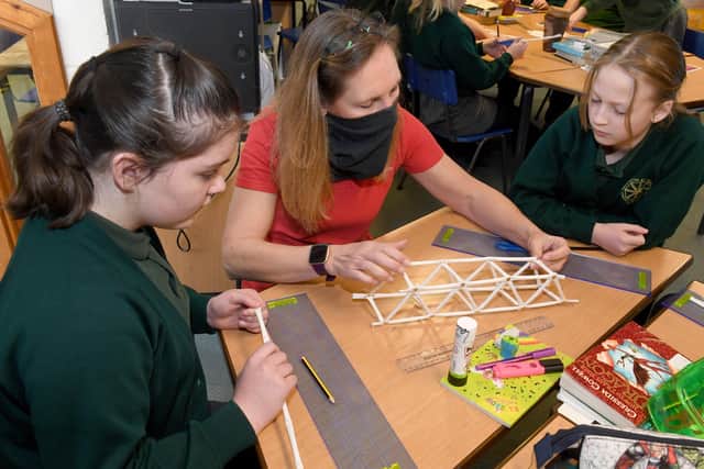 Viking Link and Hands On Science workshop leader, Larissa Slaney with Year 6 pupils L-R Edie Hern and Imogen Long. EMN-210212-111300001