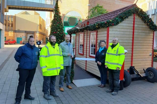 Matti Pajula and Metsa Wood's engineering team present the grotto to Lisa from Pescod Square.