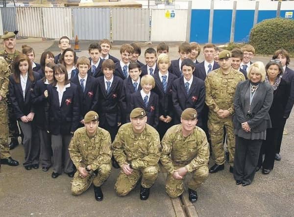 Picture (from left) Lance Sargeant Graham Nicholson, Major Lance Thornton, GdsmTom Hayward, GdsmScott Bloomer, Lance Corporal Michael Goom, Gdsm Bradley Thomas, Anne Broughton, public services instructor at St George’s Academy, and Jayne Adey, teaching assistant.