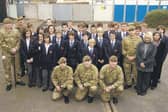 Picture (from left) Lance Sargeant Graham Nicholson, Major Lance Thornton, GdsmTom Hayward, GdsmScott Bloomer, Lance Corporal Michael Goom, Gdsm Bradley Thomas, Anne Broughton, public services instructor at St George’s Academy, and Jayne Adey, teaching assistant.