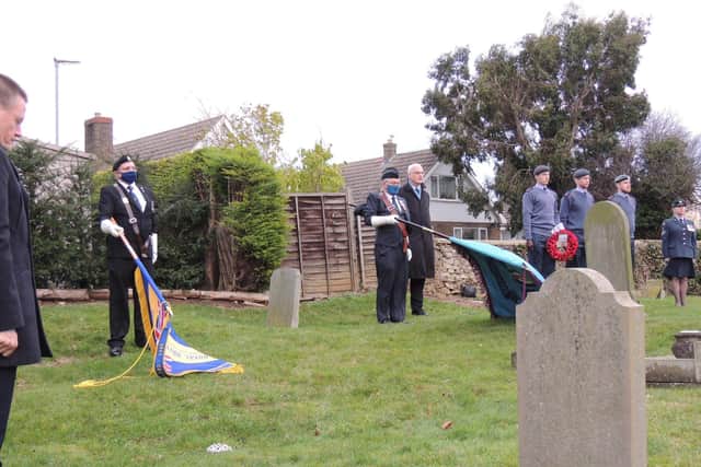 The Last Post is sounded as people remembered those buried in the churchyard. EMN-210112-170013001