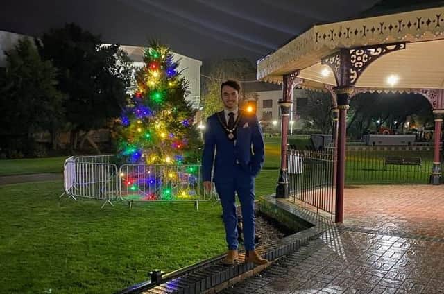 Coun Danny Brookes by the new Christmas Tree in Tower Gardens, Skegness.