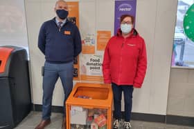 Lee Galyer, store manager at Sainsbury’s and Suzy Pearl, New Life Assistant Community Connector,  with the food donation bin at the front of the store in Spilsby.
