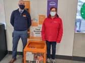 Lee Galyer, store manager at Sainsbury’s and Suzy Pearl, New Life Assistant Community Connector,  with the food donation bin at the front of the store in Spilsby.