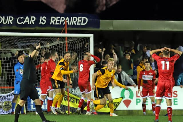 Jordan Burrow turns away to celebrate after heading home what proved to be the winner for Boston United in the 3-2 win at Kettering Town. Pictures by Peter Short