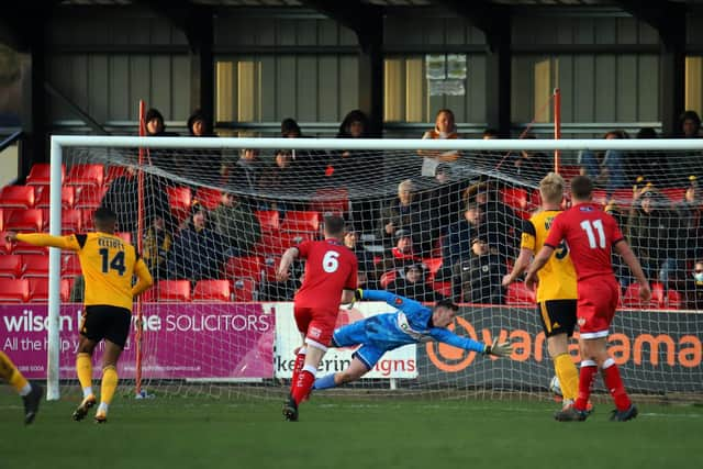 Kettering goalkeeper Jackson Smith is beaten by Paul Green's finish for Boston's first goal