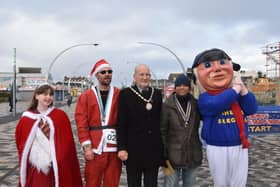 Winning Santas pictured with the Mayor of Skegness Coun Trevor Burnham,  the Carnival Princess Summer and the Jolly Fisherman.