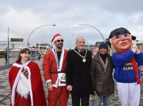 Winning Santas pictured with the Mayor of Skegness Coun Trevor Burnham,  the Carnival Princess Summer and the Jolly Fisherman.
