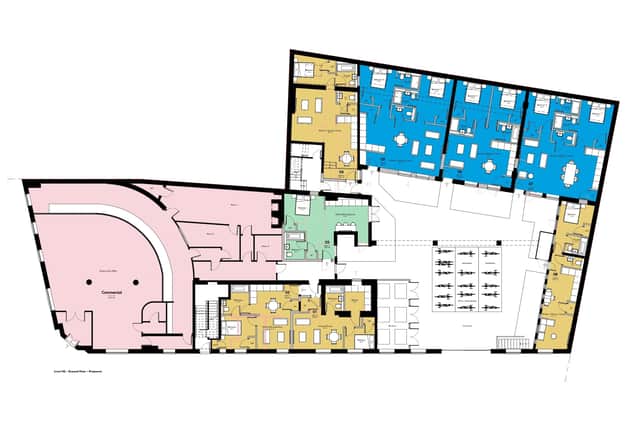 The proposed ground floor, with pink representing the commercial area and blue, yellow, and green residential. There is also a courtyard with space for 30 bicycles.
