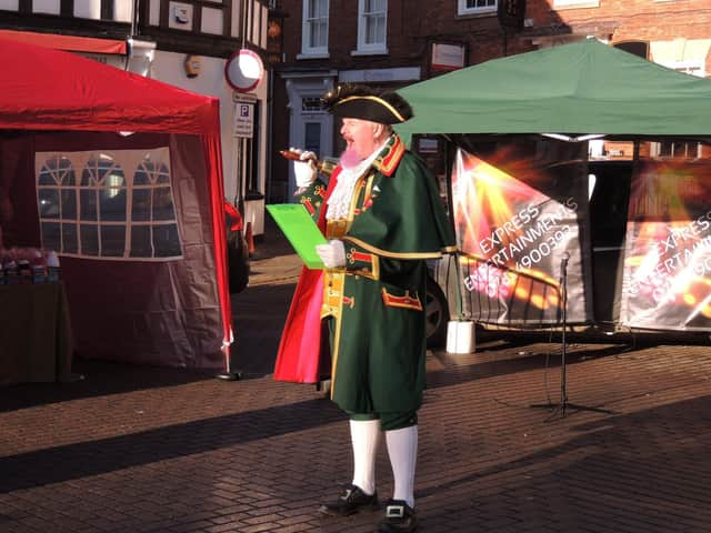 Town Crier John Griffith lets shooppers know what to look forward to on Saturday. EMN-210612-152244001