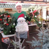 Chris Ford with his Christmas wreaths and trees. EMN-210612-152316001