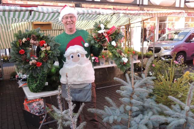 Chris Ford with his Christmas wreaths and trees. EMN-210612-152316001