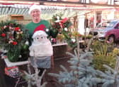 Chris Ford with his Christmas wreaths and trees. EMN-210612-152316001
