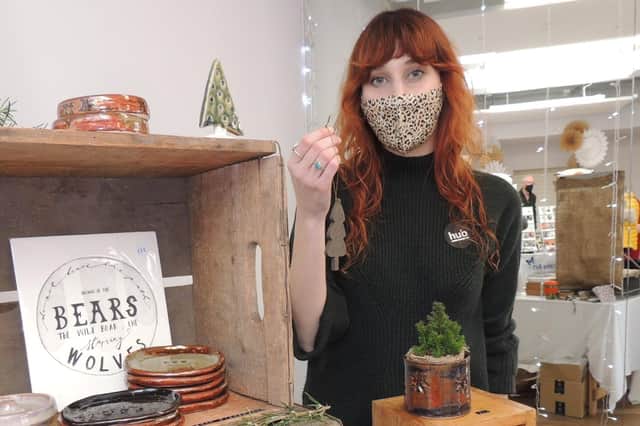 Hannah Bigley of Whaplode selling pottery gifts at the Hub craft market. EMN-210612-152525001