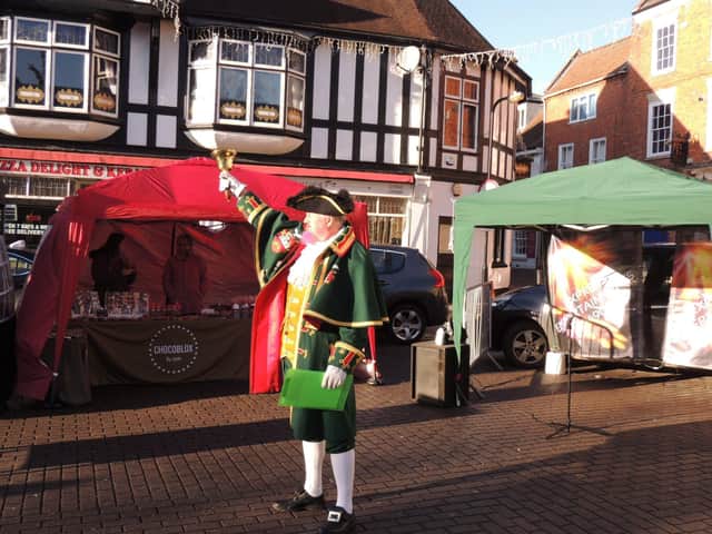Town Crier John Griffith lets shooppers know what to look forward to on Saturday. EMN-210612-152233001