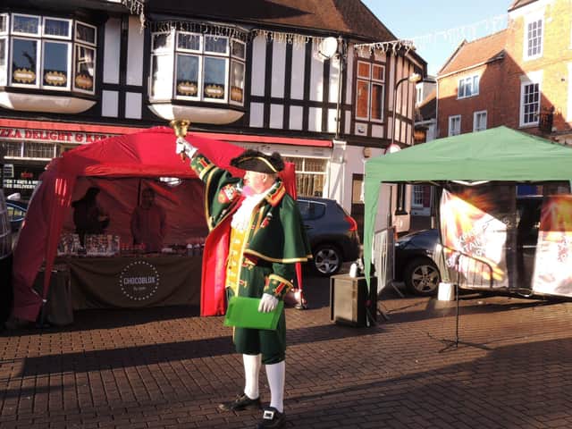 Town Crier John Griffith lets shooppers know what to look forward to on Saturday. EMN-210612-152233001
