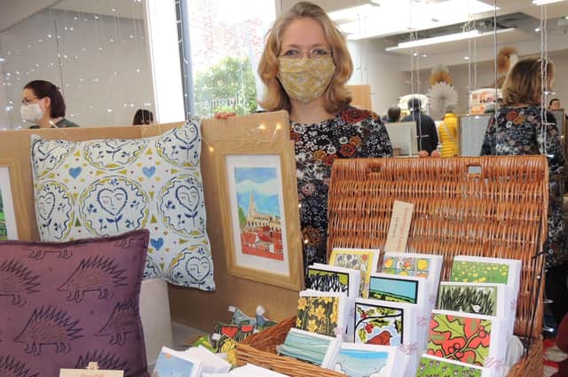 Vanessa Stone, of Bottesford, with her cards, paintings and cushions, including new work on Sleaford, for sale at the Hub craft market. EMN-210612-152515001