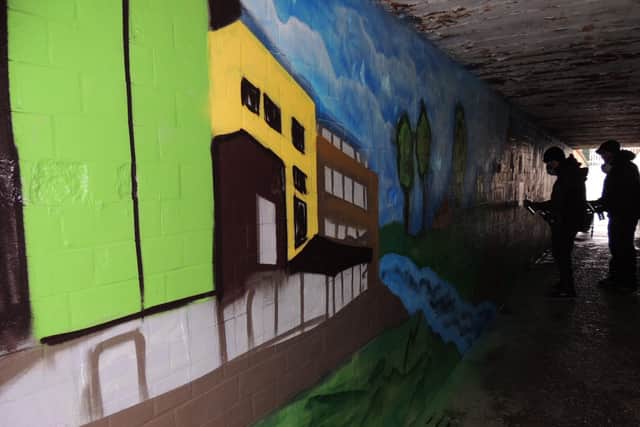 The Hub and the River Slea among the images appearing on the underpass wall mural. EMN-210912-150916001