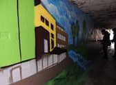 The Hub and the River Slea among the images appearing on the underpass wall mural. EMN-210912-150916001
