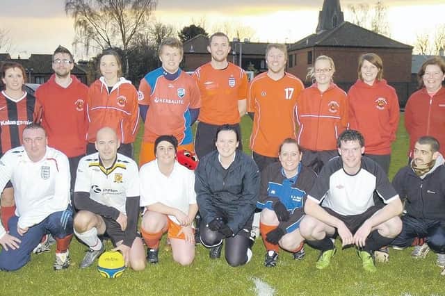 The Church Lane School staff and parents football teams, with headteacher Helen Fulcher (front centre), who refereed the game.
