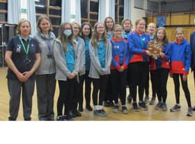 Guides and Rangers of the 4th Sleaford Company with Sir Bob Russell and the historic shield which he bought.