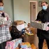 Jasmine Davis (left) Mercedes Hyatt with gifts for women's refuges in Lincolnshire.