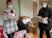 Jasmine Davis (left) Mercedes Hyatt with gifts for women's refuges in Lincolnshire.