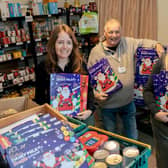 Marketing manager Olivia Stephenson (left) and sales manager Helene Key (right) , with Boston Foodbank manager Bob Taylor.